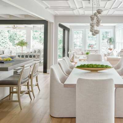 open concept designer modern home with white dining room and statement lighting